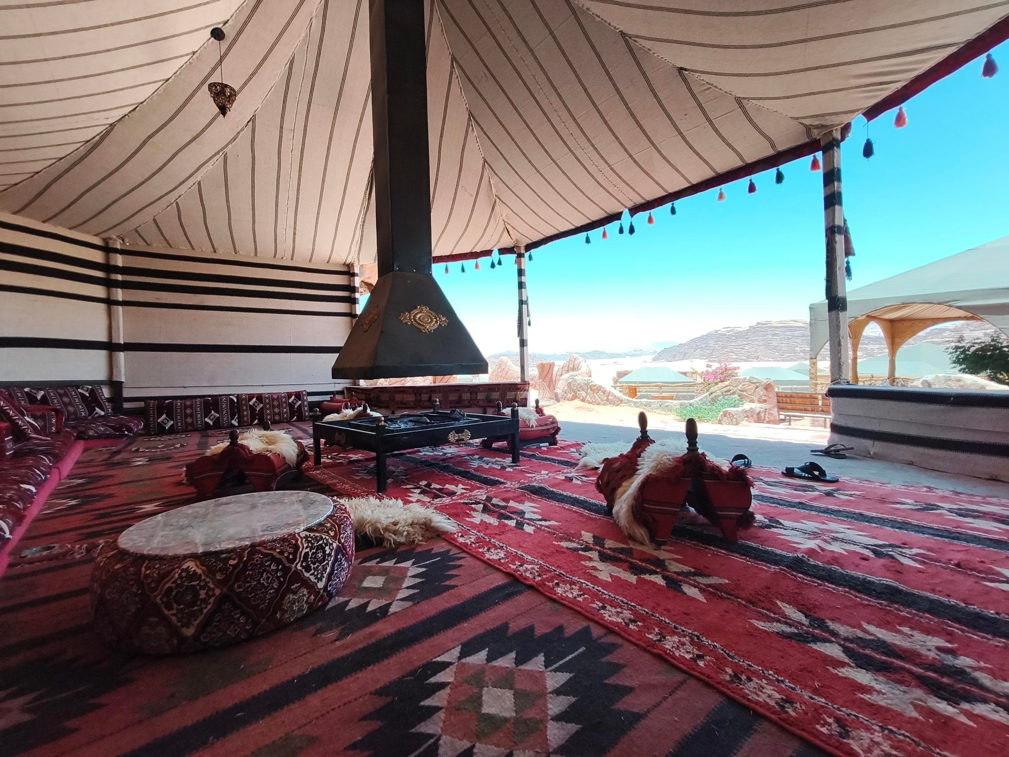 Natural sandstone rock formations framing Desert Magic Camp