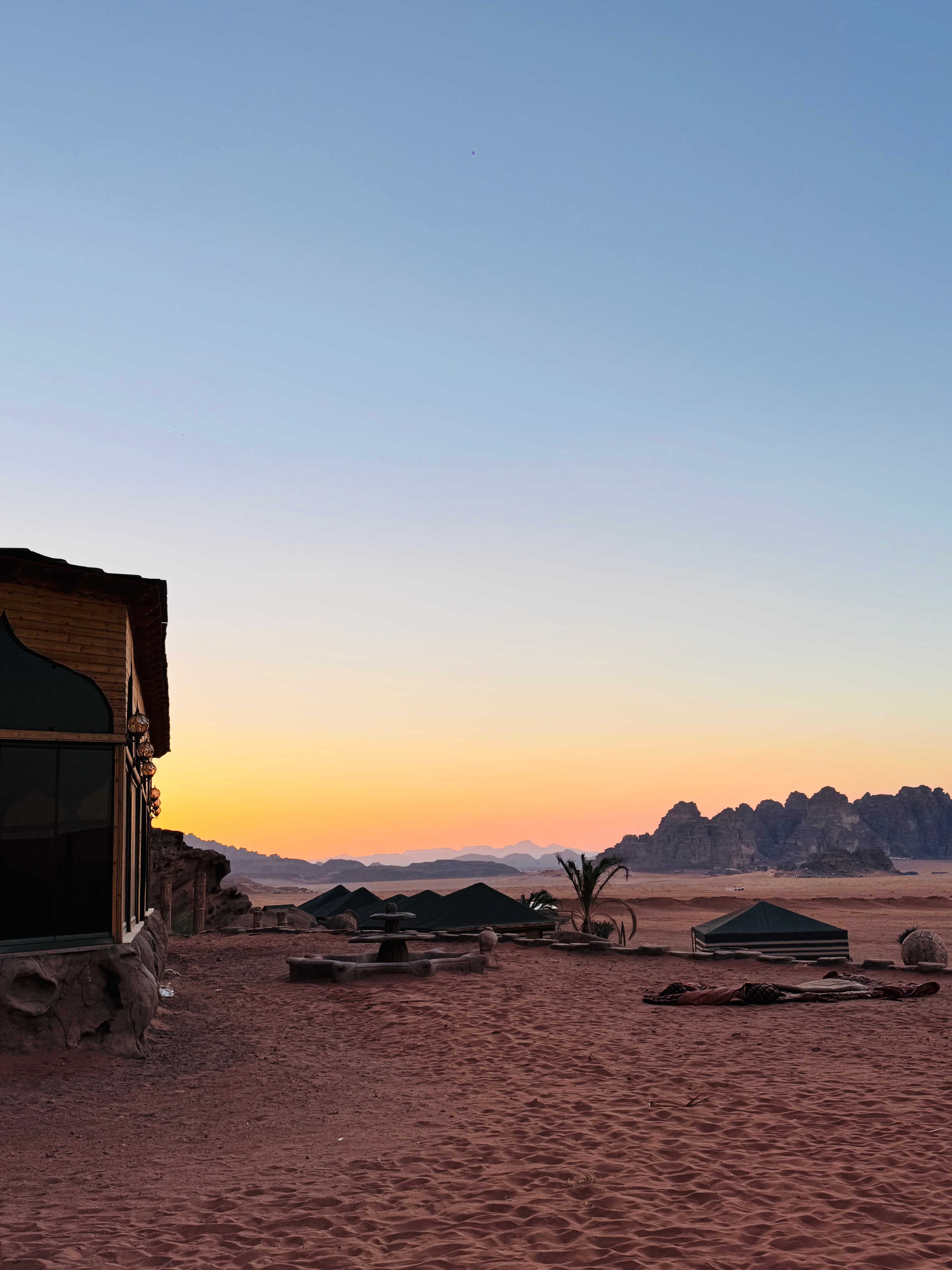 Panoramic sunset view across the camp and Wadi Rum desert